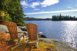 Two chairs on the lake An image of two chairs sat on the shore of one of the great lakes